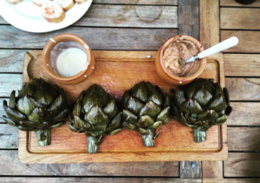 Artichokes baked with lemon butter and capers